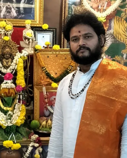 Pandit Guru Prasad Joshi, Hyderabad astrologer, reading a client's birth chart